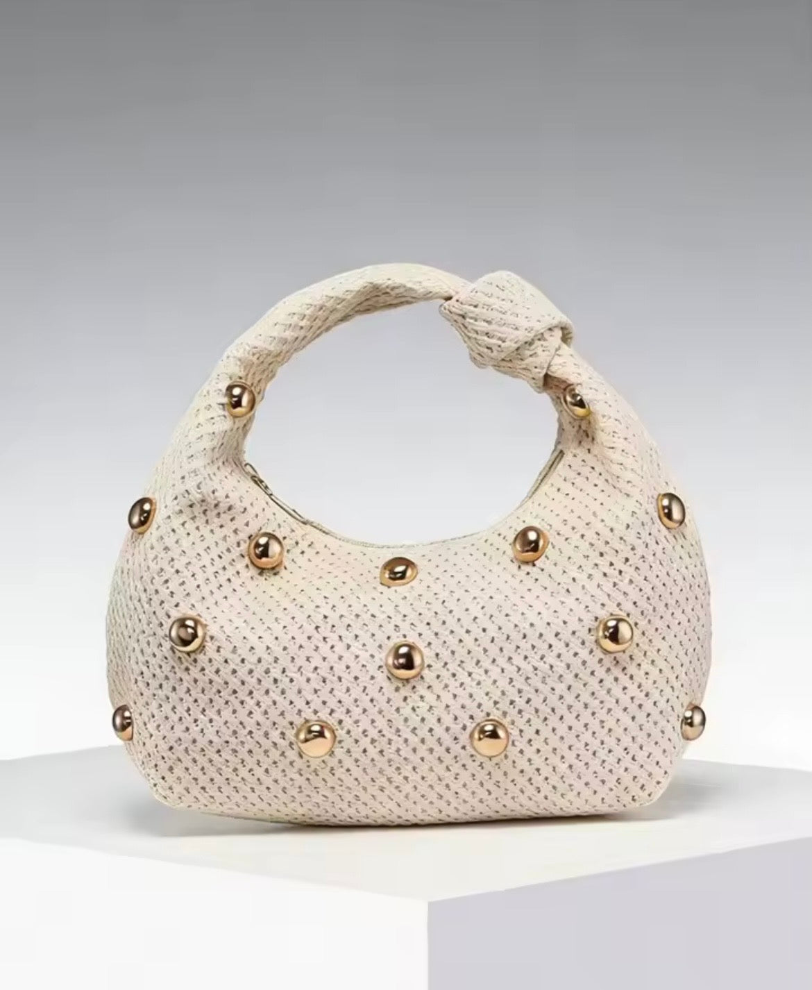 Knitted studded purse